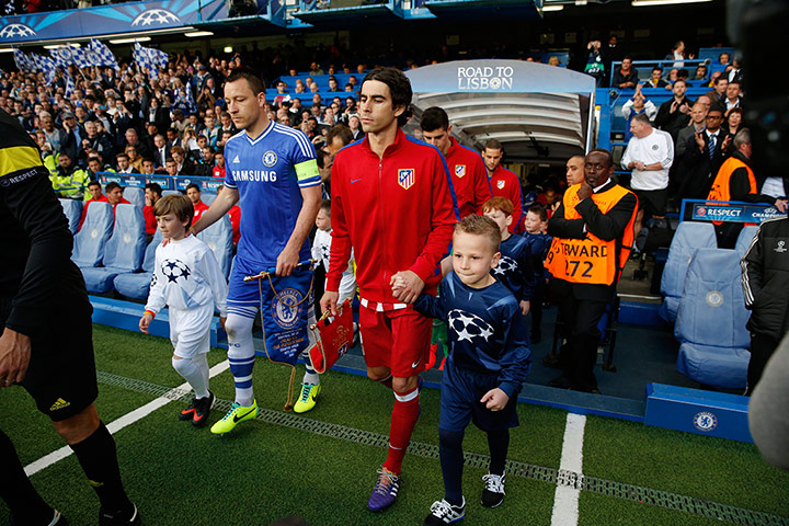 Tom's Chelsea pics: The two captains - Terry and Tiago - lead the teams out 
