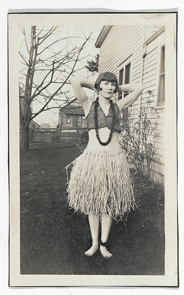 Girls Standing on Lawns: Girl with grass skirt