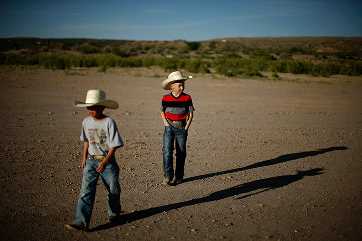 From the agencies: Zaryah Muller and Esteban Edwards walk in Truth or Consequences, New Mexico