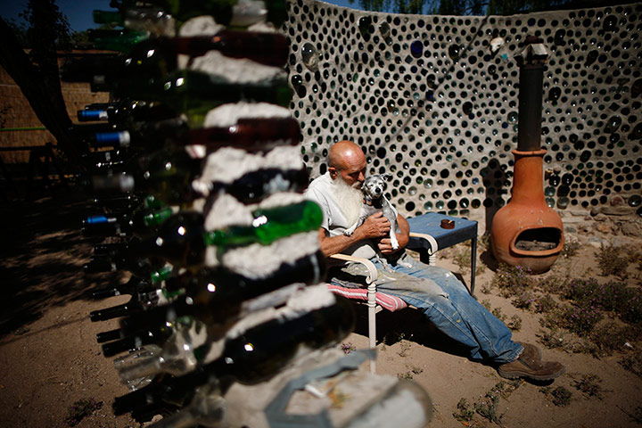 From the agencies: Artist Roy Lohr sits in a 'spaceship' that he constructed in his backyard