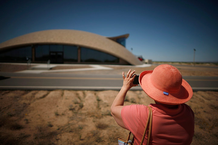 From the agencies: A woman photographs Spaceport Operations Centre in Truth or Consequences