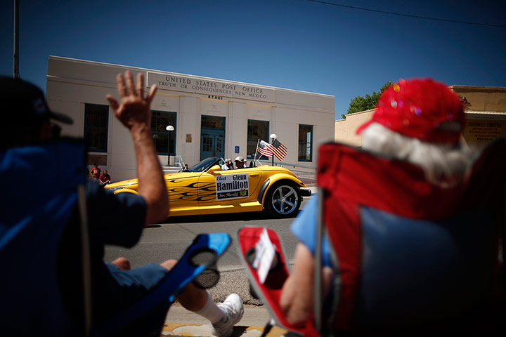 From the agencies: People wave during the annual fiesta parade in Truth or Consequences