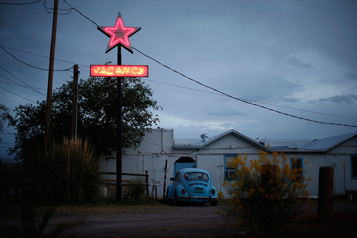 From the agencies: A motel displays a neon vacancy sign in Truth or Consequences, New Mexico