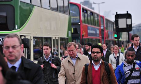 Commuters walk across Waterloo Bridge in