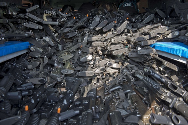 Hundreds of assault rifles to be delivered to the newly created rural police are pictured in Tepalcatepec, Mexico