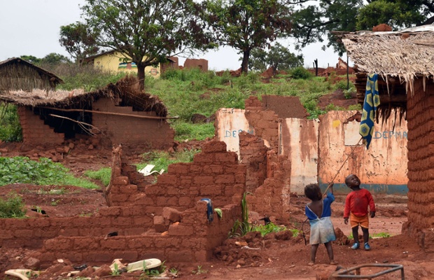 Children play in the ruins of houses damaged by former Seleka fighters in the village of Gaga, Central African Republic.