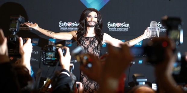 Singer Conchita Wurst representing Austria holds up the trophy after winning the Eurovision Song Contest  in Copenhagen, Denmark.