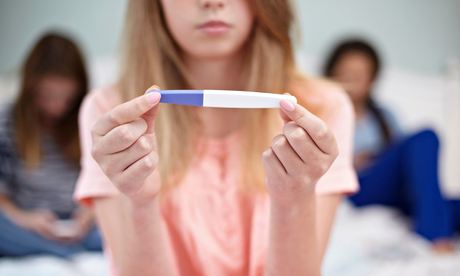 Teenage girl with pregnancy test