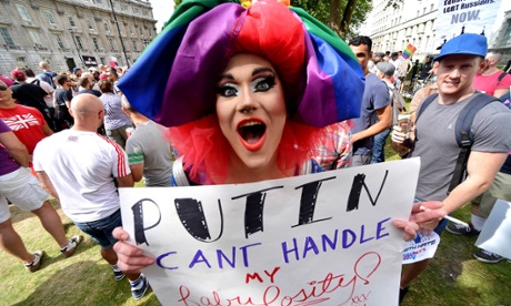 Protestor holds anti-Putin placard during protest for LGBT rights in London.