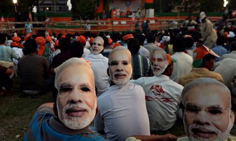 Supporters of Narendra Modi wear masks during a campaign rally in Kolkata.