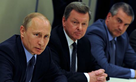 Russia's Vladimir Putin with his envoy to Crimea Oleg Belaventsev and Crimea's PM Sergei Aksyonov