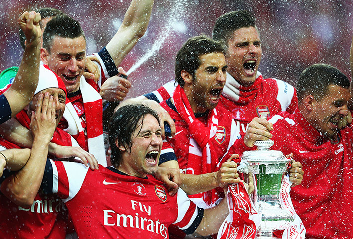 the cup final: Tomas Rosicky leads the celebrations 