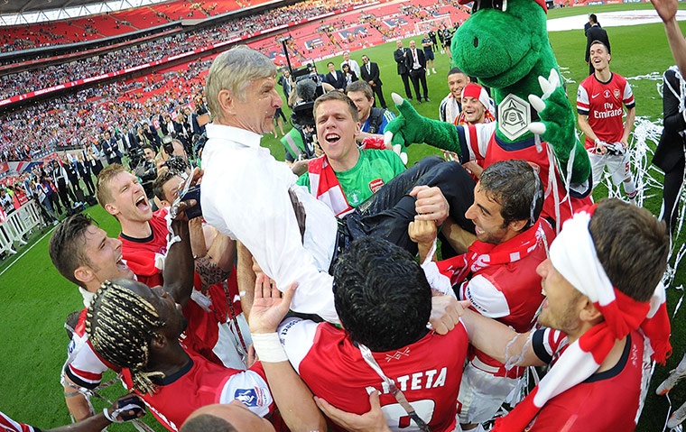 the cup final: The Arsenal squad throw manager Arsene Wenger in the air