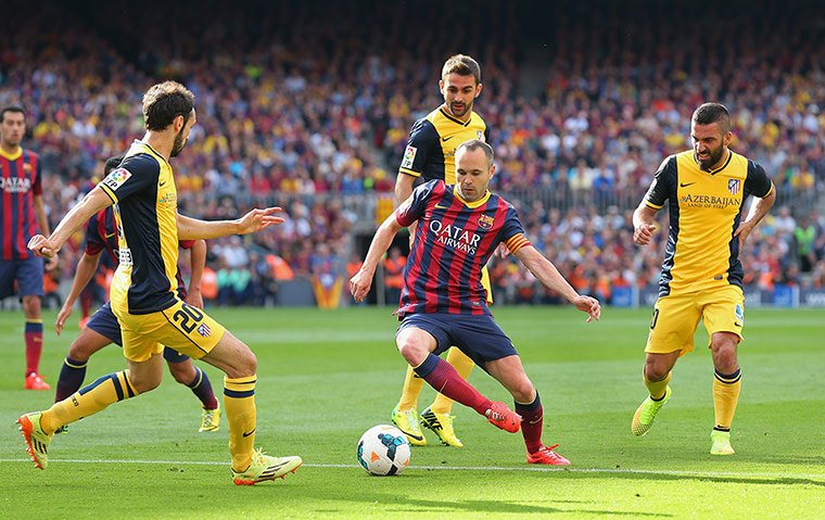 la liga final game: Andres Iniesta is closed down by Juanfran