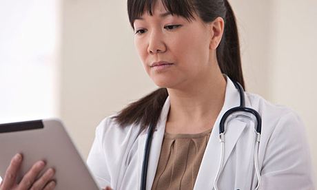 Doctor using digital tablet
