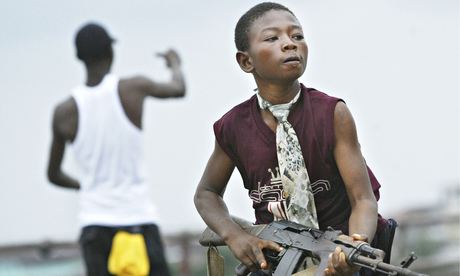 A child Liberian militia soldier on a bridge in Monrovia, Liberia.