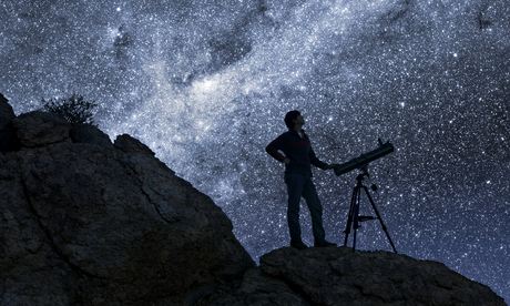 Man stargazing in desert