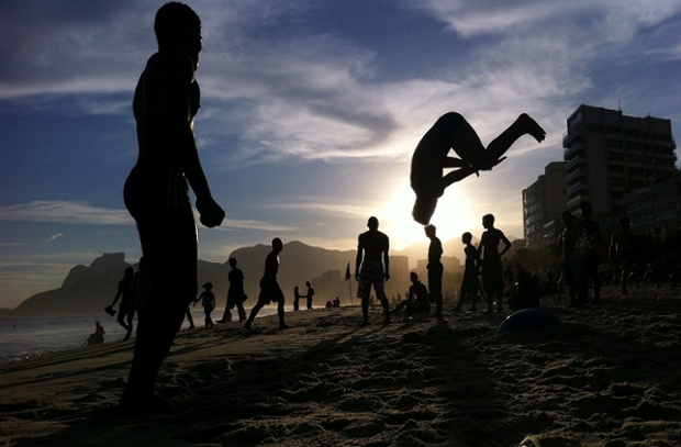 A man performs a flip on Ipanema Beach in Rio de Janeiro, Brazil. The 2014 FIFA World Cup starts in Brazil on June 12.