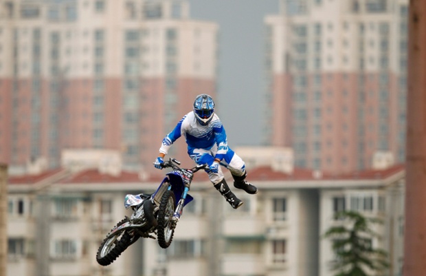 A competitor performs at the FMX Course competition during the World Extreme Games in Shanghai, China.