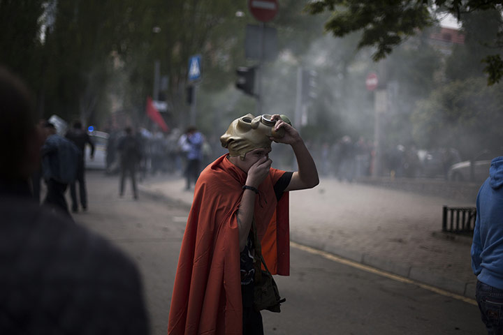 20 Photos: A pro-Russian activist after police fired teargas in Donetsk