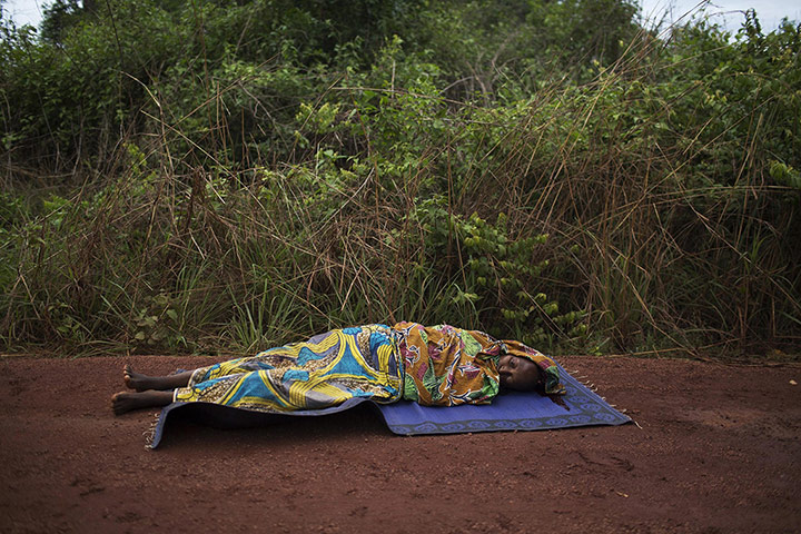 20 Photos: A woman lies injured from a gunshot in the Central African Republic