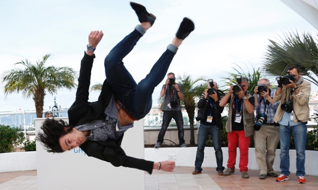 Meanwhile at the Cannes film festival, the actors are livening up the routine photocalls. French actor Rachid Youcef jumps during the photocall for Geronim.
