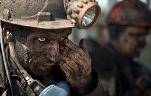 An Ukrainian coal miner wipes his eye after finishing his shift at a coal mine outside Donetsk, Ukraine.