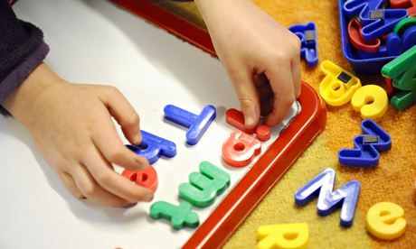 Child playing with magnetic letters