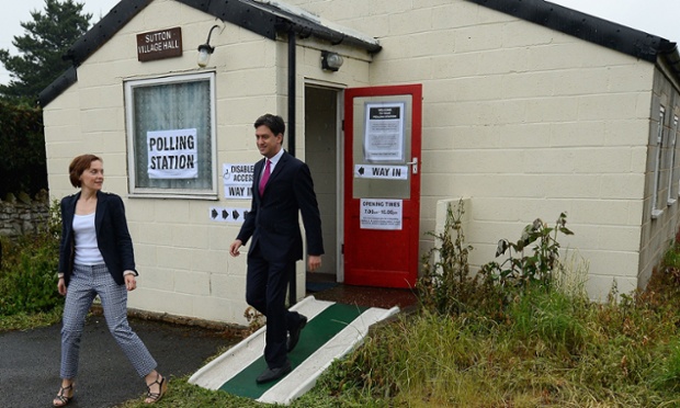 British opposition Labour Party leader Ed Miliband and his wife Justine leave Sutton Village Hall, southeast of Leeds in northern England after voting today