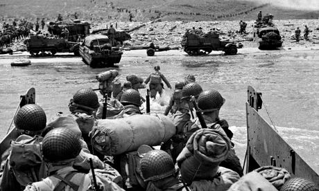 American troops in landing craft go ashore on one of four beaches in Normandy on D-Day, June 6 1944