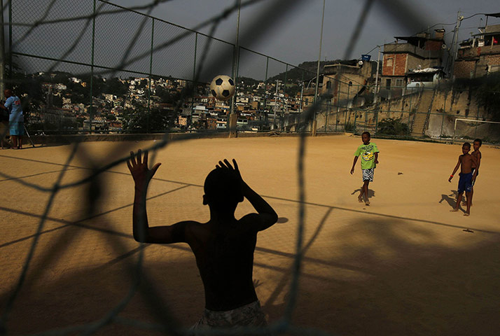 20 Photos: Children play football at a coaching session in Rio de Janeiro