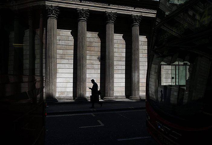 20 Photos: A man is reflected in a bus windscreen in the City of London