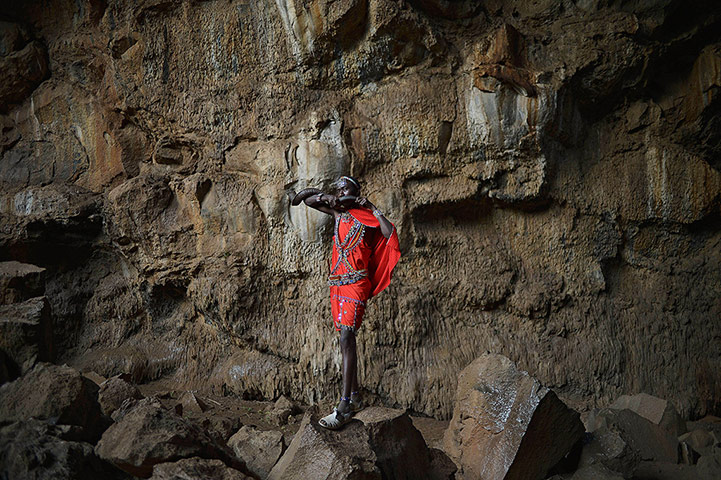 20 Photos: A young Maasai man blows a blow horn at Suswa caves in Kenya