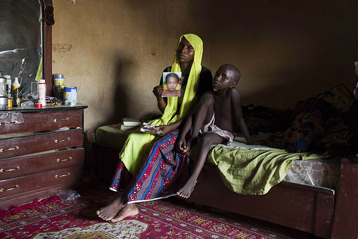 20 Photos: Rachel Daniel with a picture of her abducted daughter in Maiduguri