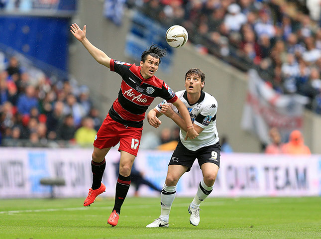 Play Off: QPR's Joey Barton battles for the ball with Derby County's Chris Martin 