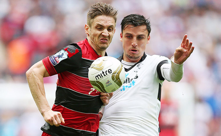 Play Off: QPR's Kevin Doyle in action with Derby's George Thorne