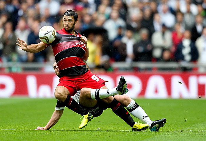 Play Off Final: Charlie Austin of QPR is bought down by Jake Buxton of Derby