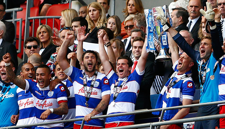Play Off QPR: Queens Park Rangers players lift the trophy and celebrate