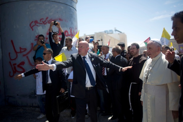 Pope Francis walks towards Israel's separation barrier on his way to a mass in Manger Square,  Bethlehem.
