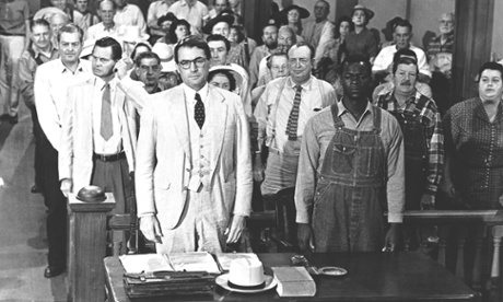 Actors Gregory Peck, front left, and Brock Peters, front right, are shown in a scene from the 1962 film To Kill a Mockingbird.
