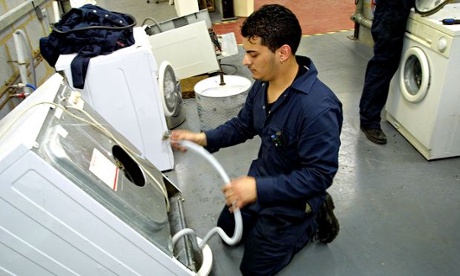 Re-use: Repairing a discarded washing machine.