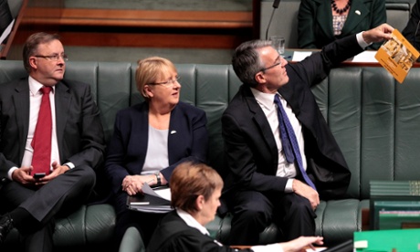 Shadow AG Mark Dreyfus using a Workchoices mouse pad to make a point in question time while Anthony Albanese and Jenny Macklin watch.