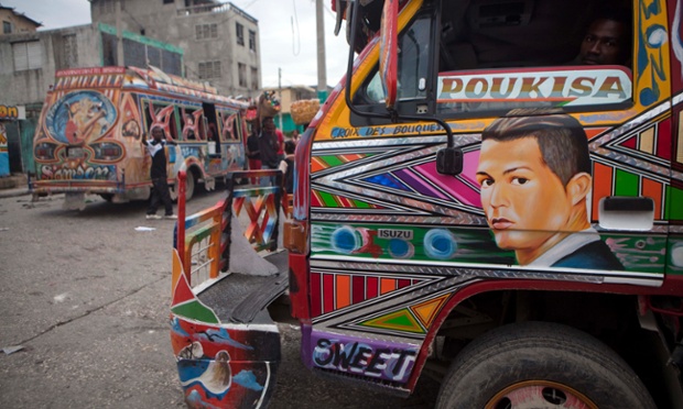 In this May 21, 2014 photo, a painting of Portugal's soccer player Cristiano Ronaldo decorates a tap-tap passenger bus in Port-au-Prince, Haiti. The capital's public busses are getting covered by the faces of soccer stars ahead of the World Cup that starts in June in Brazil. (AP Photo/Dieu Nalio Chery) plg