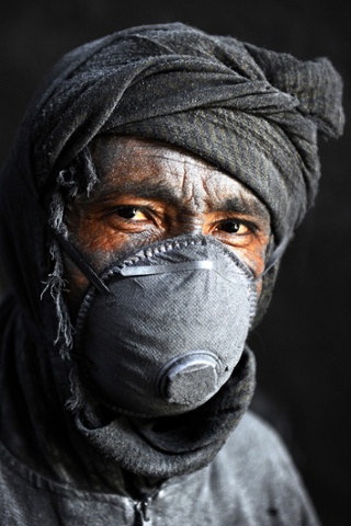 An Afghan labourer poses at an aluminium workshop in Herat.