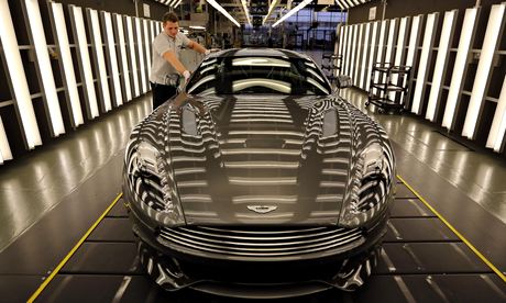 An Aston Martin Vanquish being inspected by hand