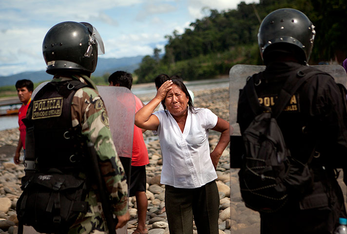 Illegal gold mining: A woman cries in front of police
