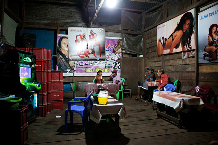 Illegal gold mining: People gather in a bar at an illegal gold mine