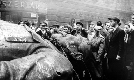Hungarian protesters gather around a fallen statue of Josef Stalin in Budapest in October 1956.