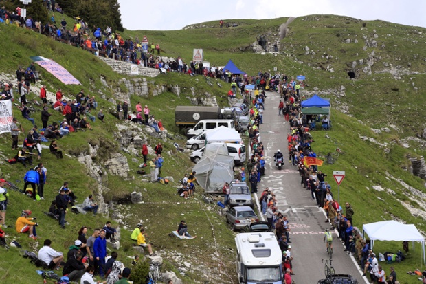 Chugging his way up the hill, Michel Koch competes in the uphill time trial in the 19th stage of the 97th Giro d'Italia. [He's the one in green on a bike....]