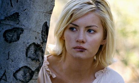 Kim Bauer (Elisha Cuthbert) being an idiot behind a tree. 